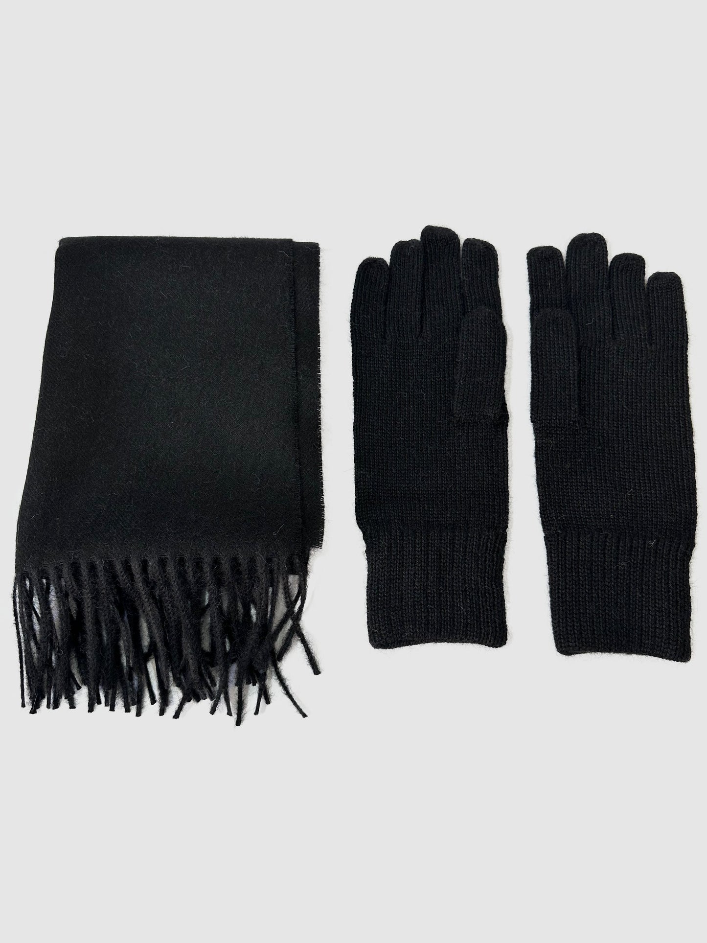 Solid black baby alpaca scarf, hand-finished. Measures 180 cm in length by 30 cm in width. Also, one-size solid black baby alpaca gloves.