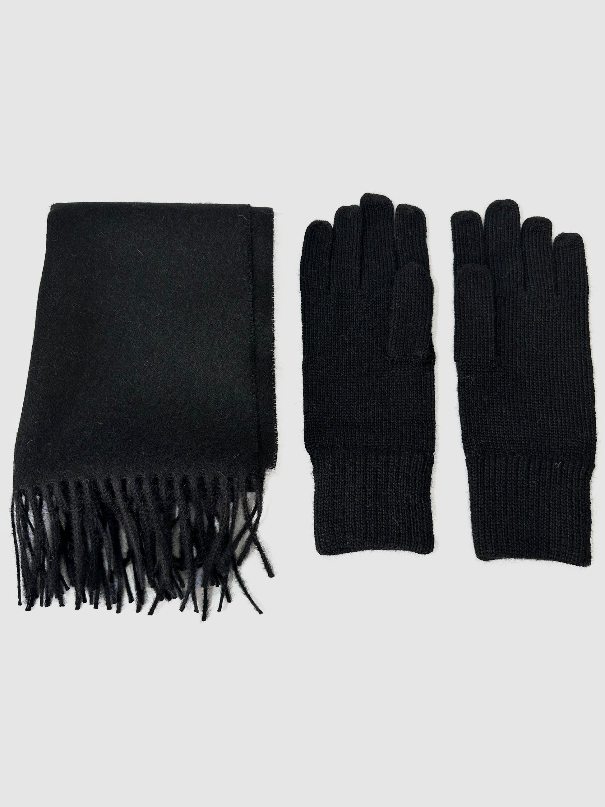 Solid black baby alpaca scarf, hand-finished. Measures 180 cm in length by 30 cm in width. Also, one-size solid black baby alpaca gloves.