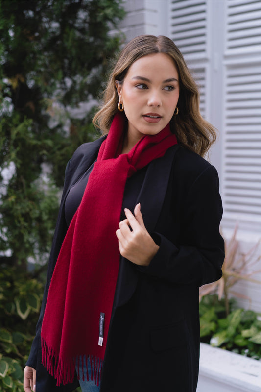 Soft and stylish alpaca scarf in wine color, perfect for elegant winter outfits.